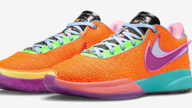 View of orange, purple, and pink Nike LeBron shoes.